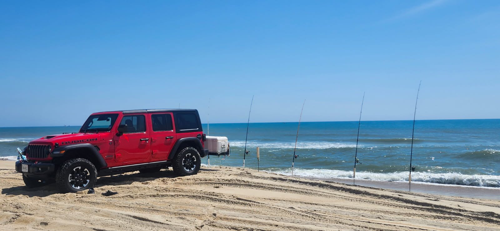 Jeep Wrangler Rubicon and surf fishing cart on an OBX beach